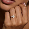 A Woman Show Off a 1CT Marquise Cut Cluster Moissanite Engagement Ring