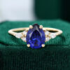 Classic Pear Cut Gold Sapphire Engagement Ring with Diamond Cluster