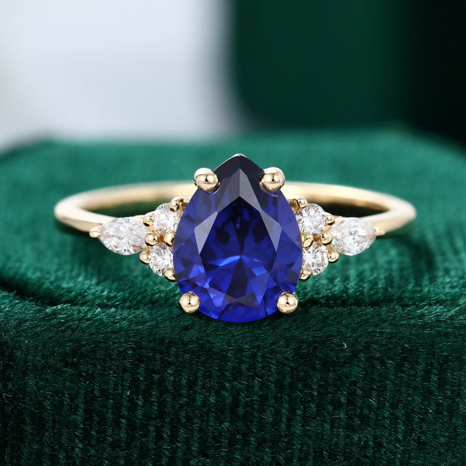 Classic Pear Cut Gold Sapphire Engagement Ring with Diamond Cluster