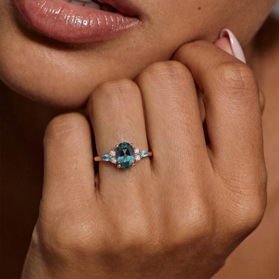 Oval Cut Gold Alexandrite Cluster Engagement Ring with Topaz Accents