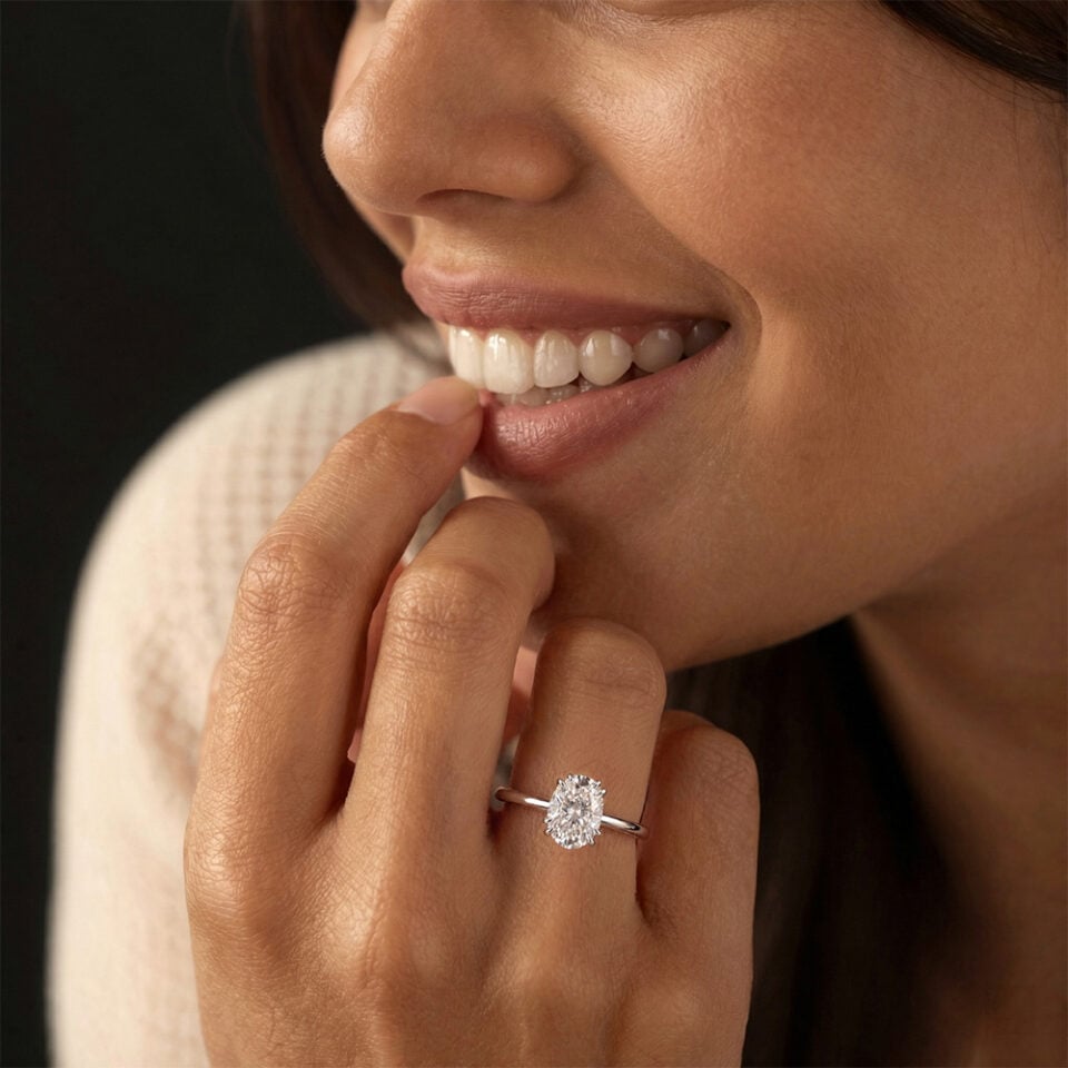 White gold oval moissanite double claw prong solitaire engagement ring
