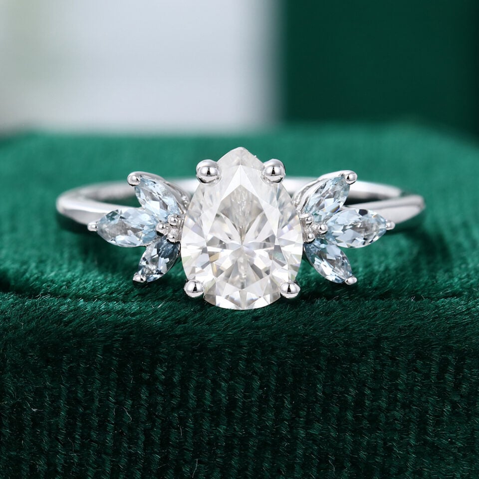 Pear Shaped Moissanite With Aquamarine Wings Engagement Ring