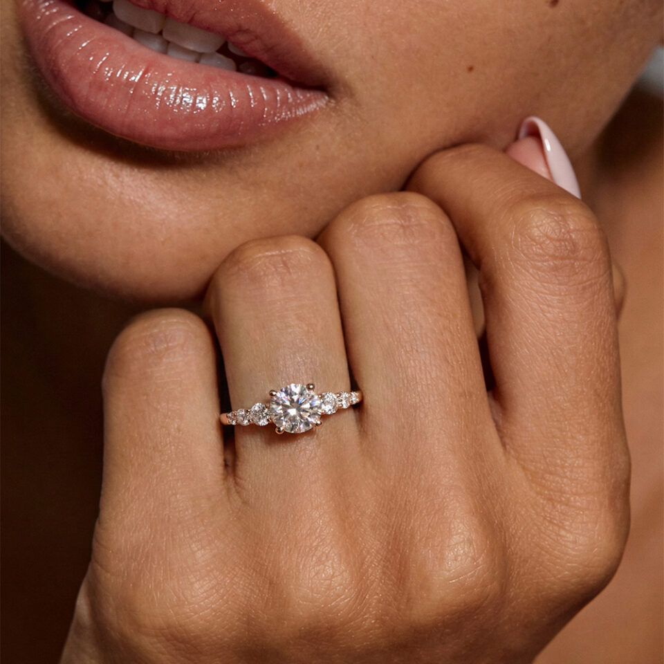 Round cut moissanite engagement ring white gold with gradient side stones