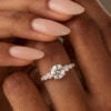 Round cut moissanite engagement ring white gold with gradient side stones