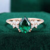 Pear Shaped Emerald & Diamond Engagement Ring with Blossom Cluster Accents