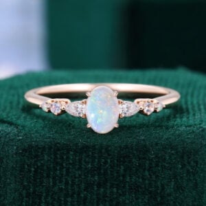 Asteria | Oval Cut Opal Dainty Engagement Ring with Trio Side Stones