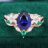 Pear Cut Lab Sapphire with Moissanite Floral Side Stone Bridal Wedding Set in Solid Rose Gold