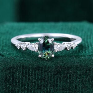 Oval Teal Sapphire and Diamond Engagement Ring with Trio Tapered Accents