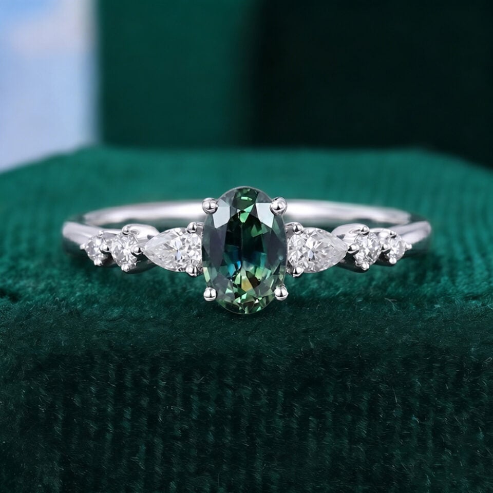 Oval Teal Sapphire and Diamond Engagement Ring with Trio Tapered Accents