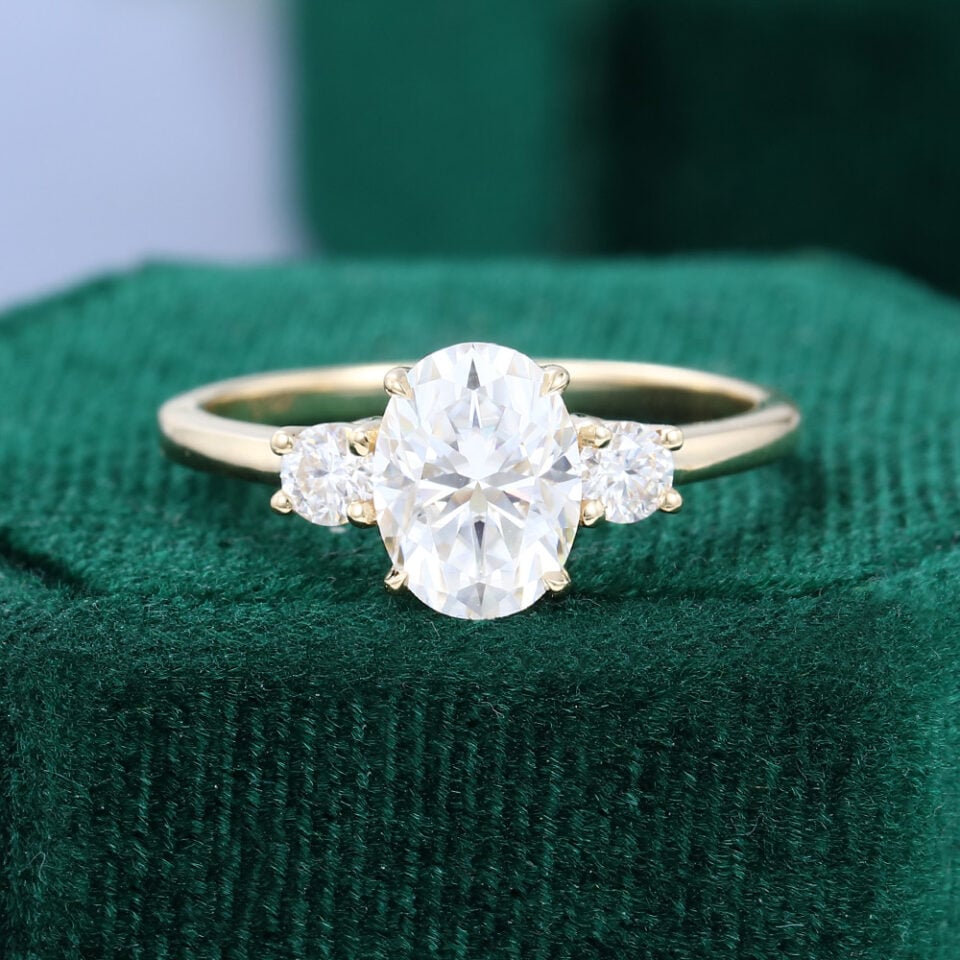 oval cut moissanite three stone engagement ring