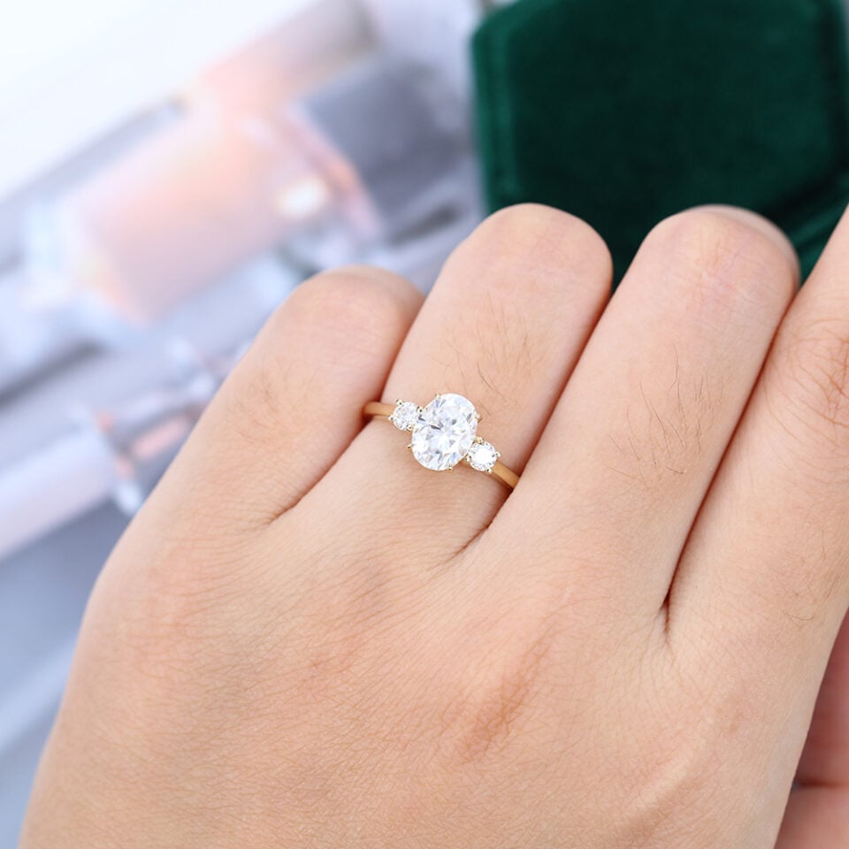 Three Stone Oval Cut Moissanite Engagement Ring In Yellow Gold