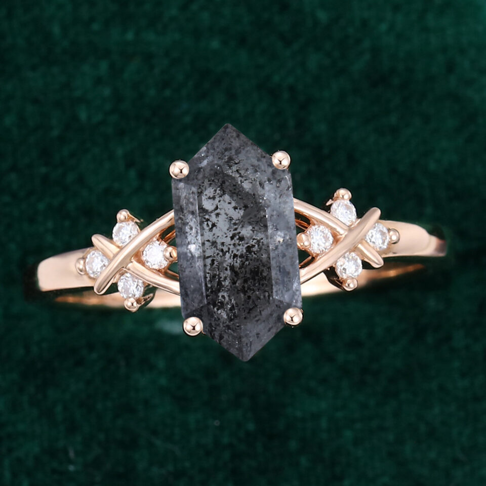 Hexagon cut black speckled diamond criss cross engagement ring