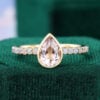 Bezel Set Pear Cut Pink Morganite Pavé Engagement Ring with Opal Accent (1)