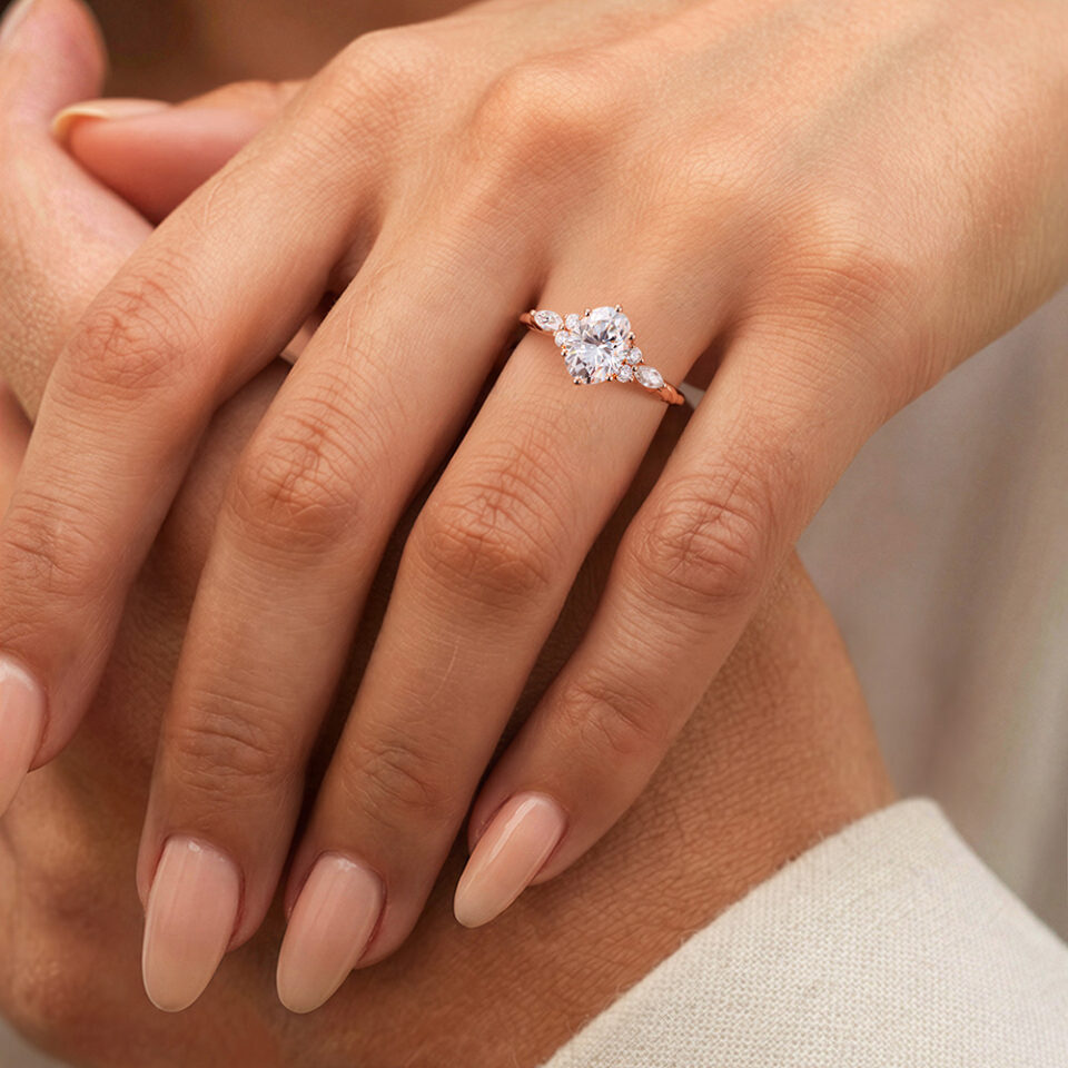 Admire an Oval Cut Twisted Moissanite Engagement Ring with Classic Side Stone