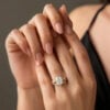 A 2CT Oval Cut Nature Inspired Moissanite Bridal Ring Set on the Hand