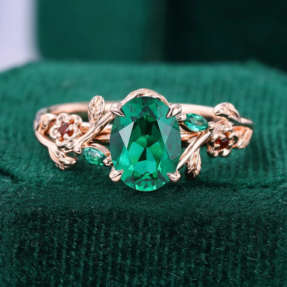 Garden Themed Oval Cut Emerald Engagement Ring With Flower & Leaf Accents