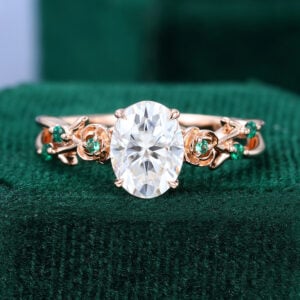 Oval Cut Moissanite Blossom Engagement Ring With Emerald Accents