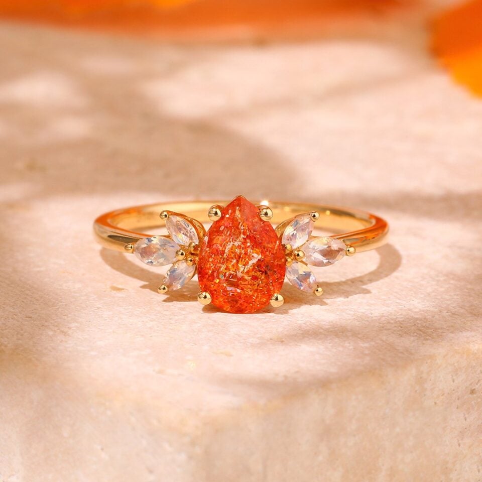 pear sunstone ring with moonstone accents