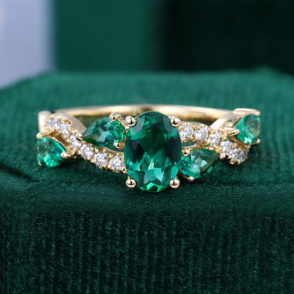 Oval Cut Emerald Engagement Ring With Alternating Crossover Shank