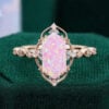 Filigree floral halo vintage long hexagonal pink opal engagement ring with milgrain accents