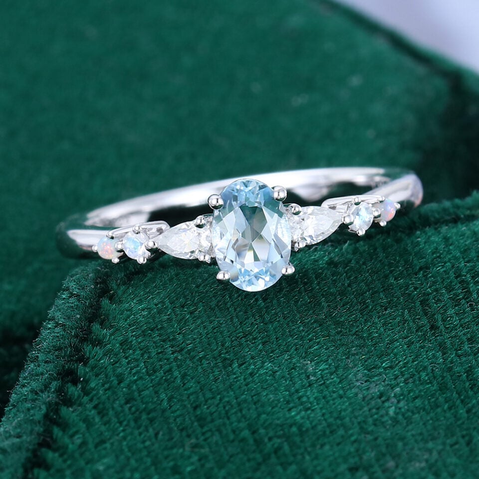 Oval Cut Aquamarine Dainty Engagement Ring With Trio Side Stones (5)