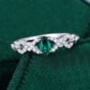 Oval Cut Emerald Engagement Ring With Interlock Crossover Band (10)