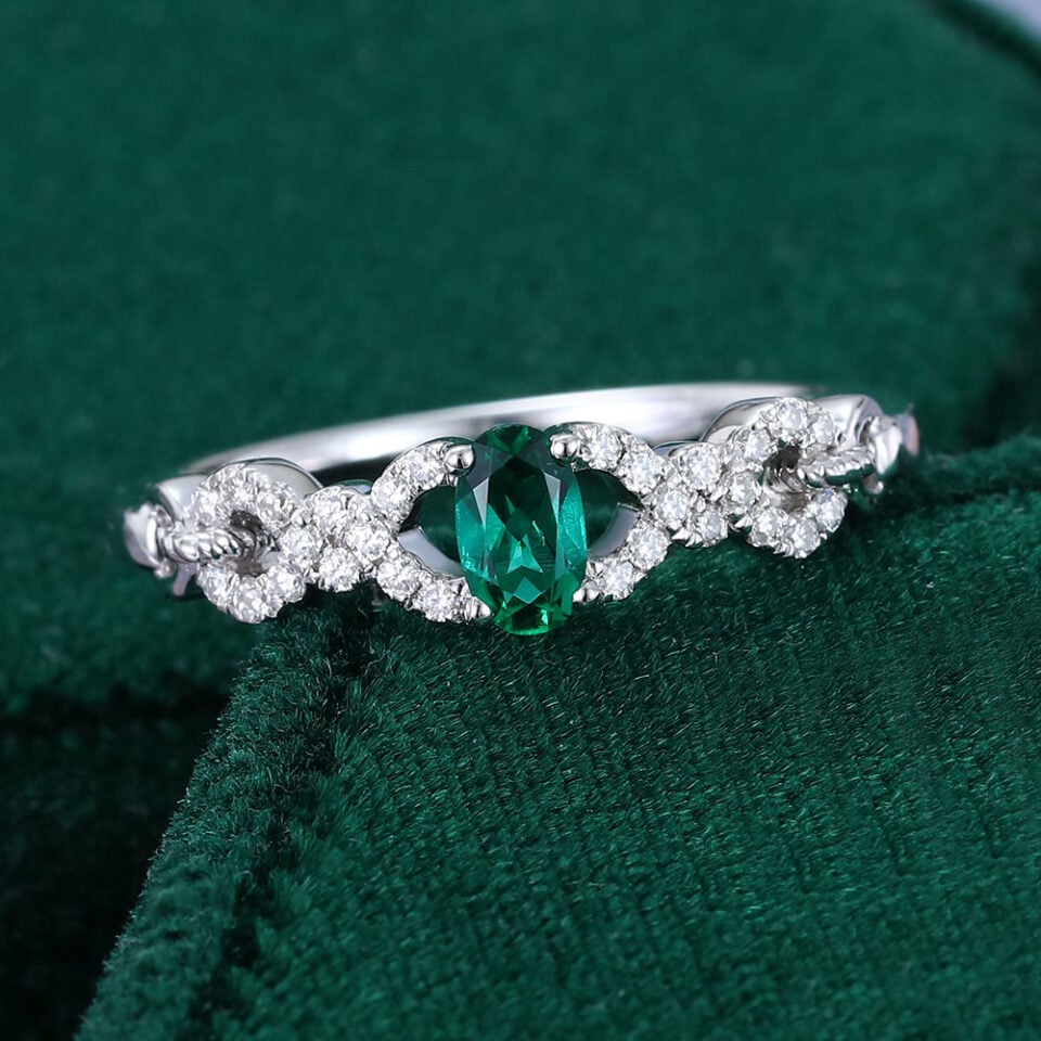 Oval Cut Emerald Engagement Ring With Interlock Crossover Band (10)