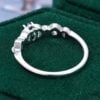 Oval Cut Emerald Engagement Ring With Interlock Crossover Band (11)