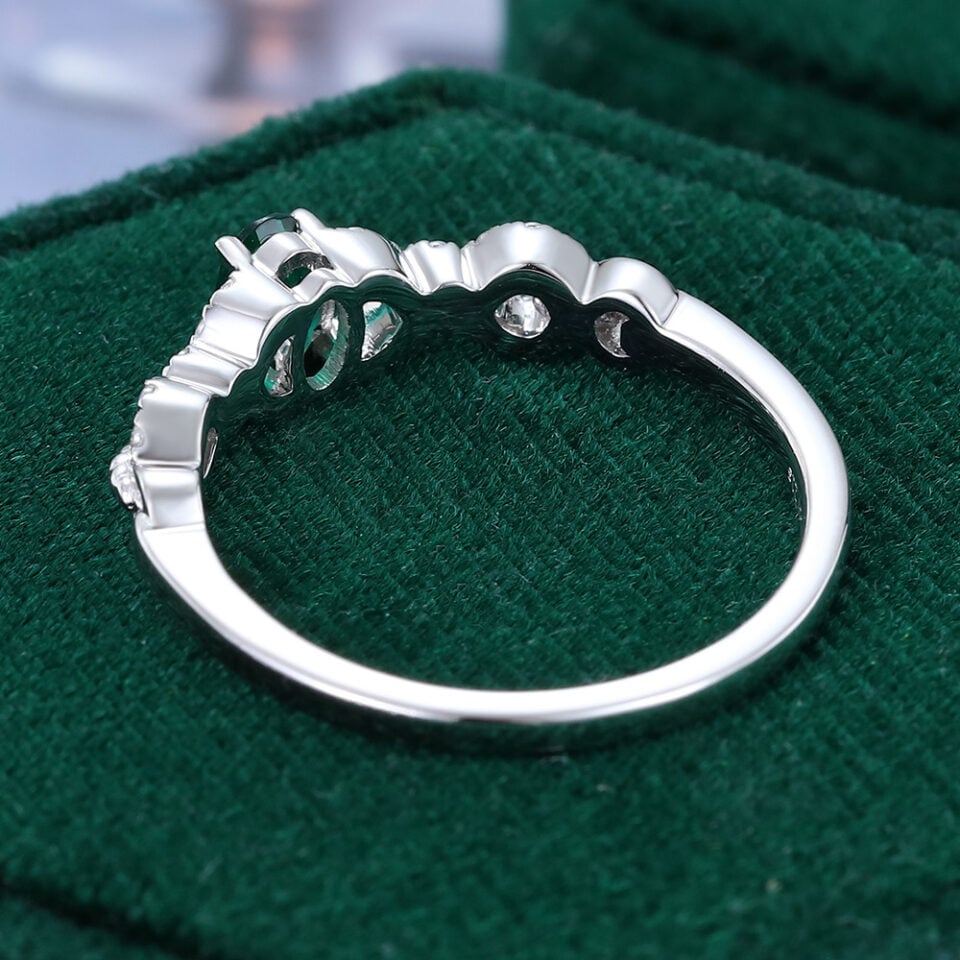 Oval Cut Emerald Engagement Ring With Interlock Crossover Band (11)