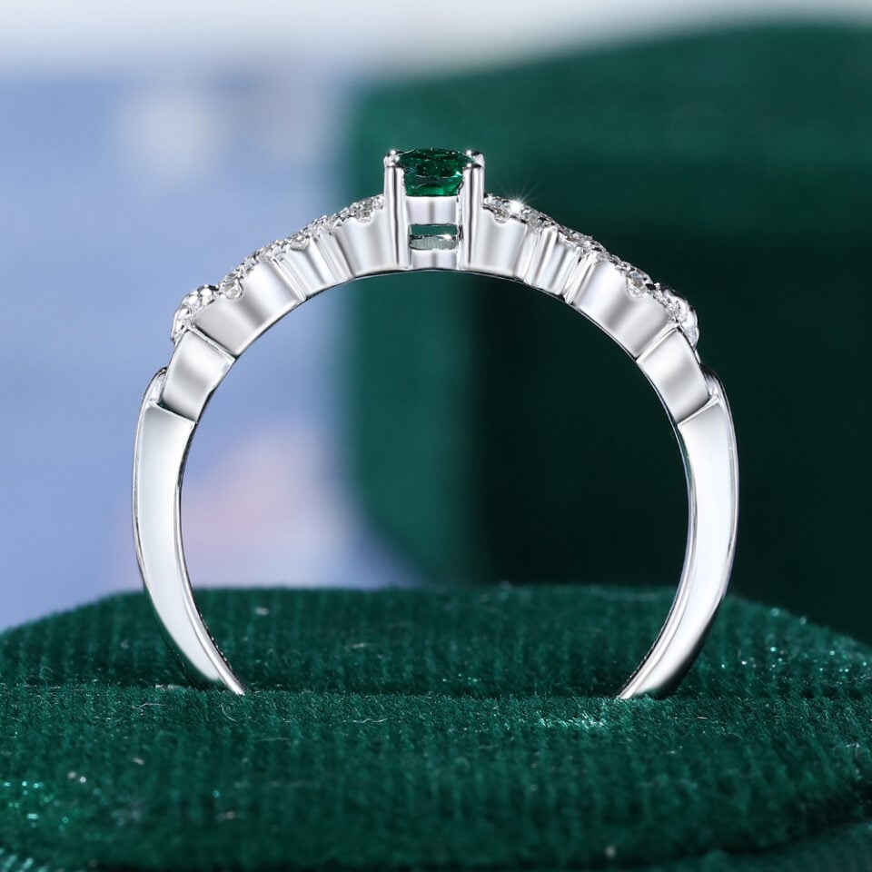 Oval Cut Emerald Engagement Ring With Interlock Crossover Band (13)