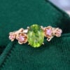 Oval Cut Peridot Engagement Ring With Cherry Blossom Accents (3)