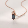 Long hexagon cut alexandrite pendant necklace with floral diamond accents