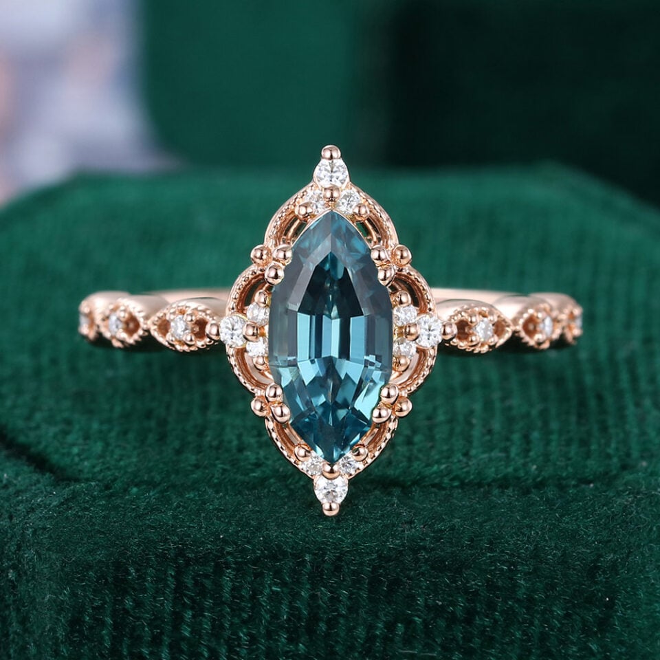 Filigree Floral Halo | Step Marquise Cut Lab Teal Sapphire Engagement Ring With Vintage Milgrain Band