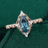 Step marquise cut lab teal sapphire engagement ring with vintage milgrain band