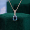 Pear cut alexandrite pendant necklace with diamond accents