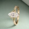 Vintage Inspired Marquise Cut Moissanite Engagement Ring with Teal Sapphire Accents (5)