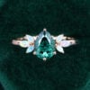 Pear Shaped Green Moissanite Engagement Ring with Opal Side Stones (2)