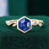 Bezel Set Hexagon Cut Sapphire Engagement Ring With Alternating Leaf Band