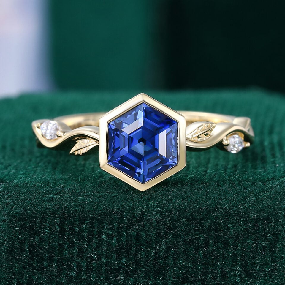 Bezel Set Hexagon Cut Sapphire Engagement Ring With Alternating Leaf Band