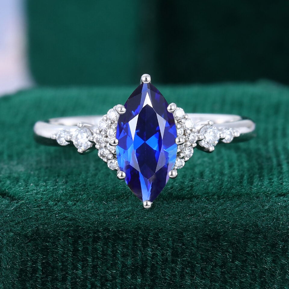 Marquise Cut Sapphire Engagement Ring With Moissanite Cluster Accents