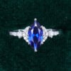 Marquise Cut Sapphire Engagement Ring With Moissanite Cluster Accents (9)