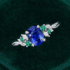 Nature Inspired Oval Cut Sapphire Cluster Engagement Ring with Leaf Prong (21)