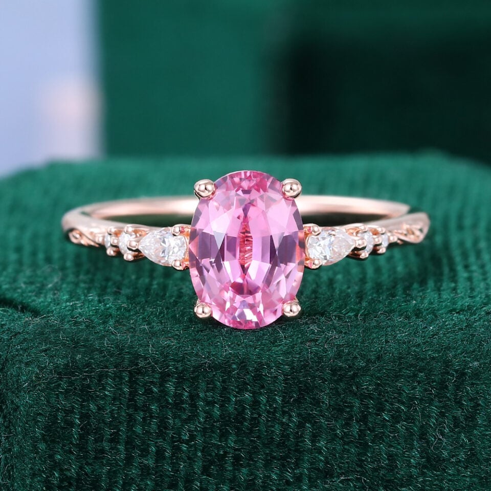 Oval Cut Pink Sapphire Leaf Engagement Ring with Trio Tapered Accents