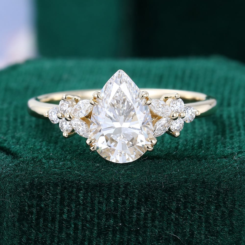 pear shaped lab diamond engagement ring with flower