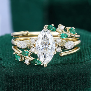 marquise cut diamond ring set with emeralds