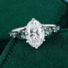 Oval Cut Lab Diamond Engagement Ring with Teal Sapphire Accents (12)
