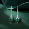 Twisted Design Kite Cut Emerald Dangle Earrings