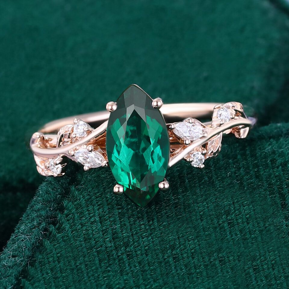 Nature inspired marquise cut emerald engagement ring with hidden detail