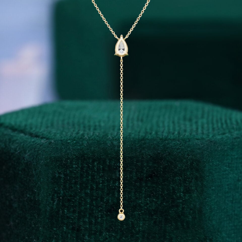 Pear cut lab diamond pendant necklace with round drop accent