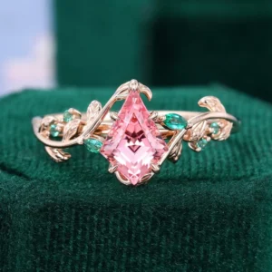 Kite Cut Pink Sapphire Ring With Emerald Accents